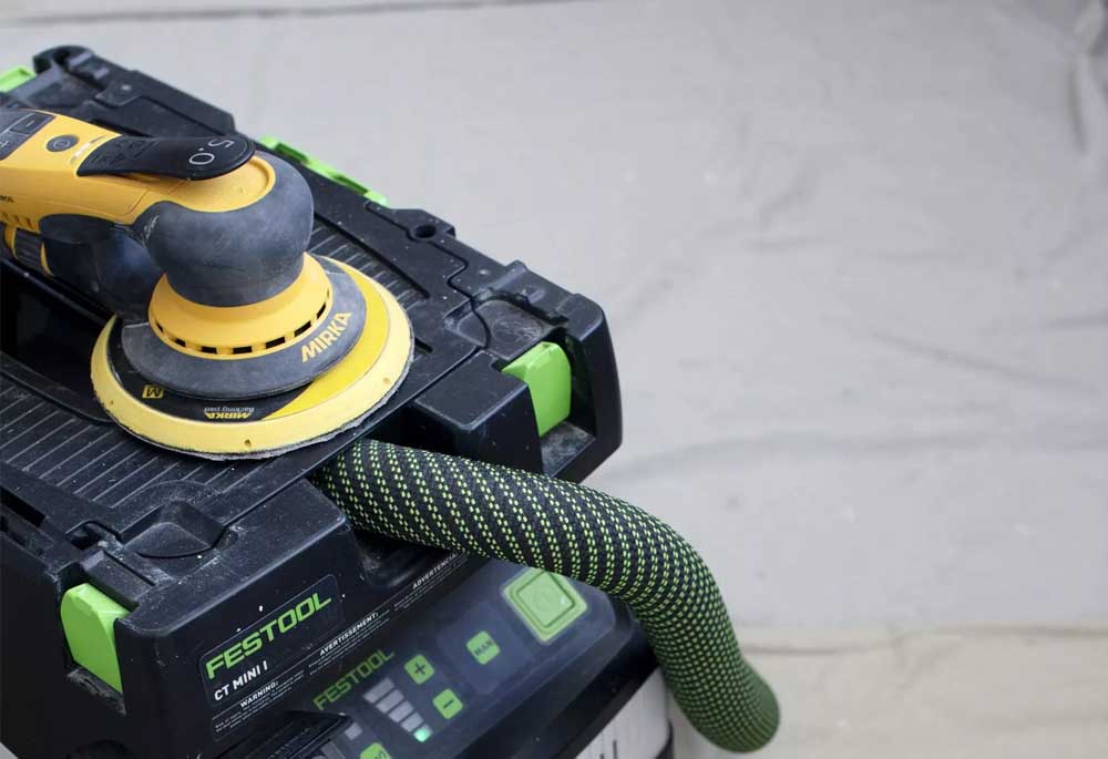 A dust extractor, used to prepare the exterior of a house for the best possible paint job.